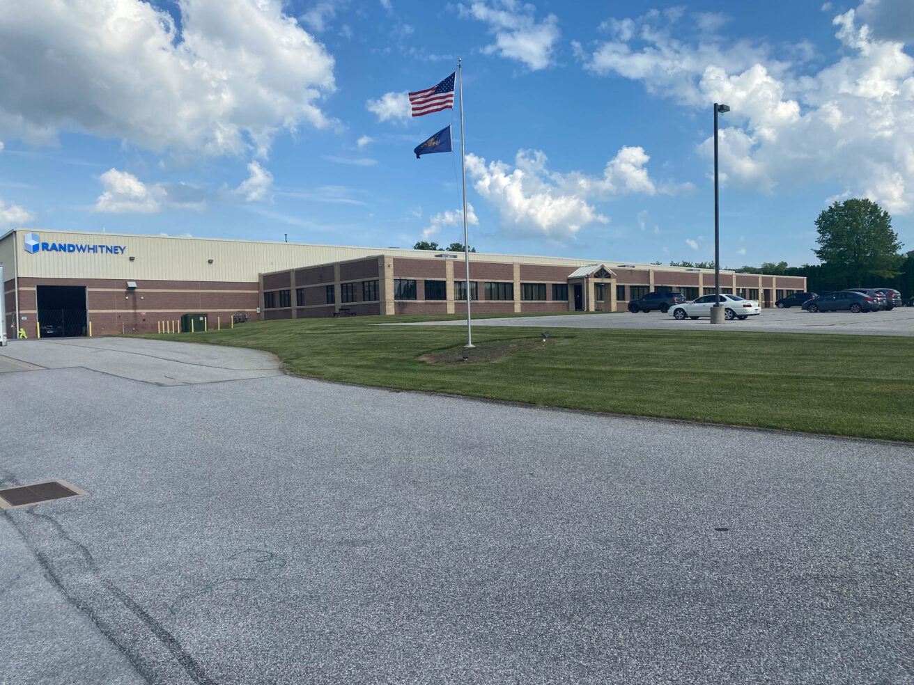 A building with an american flag in front of it.