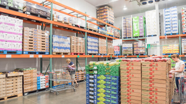 A large warehouse with shelves full of food.