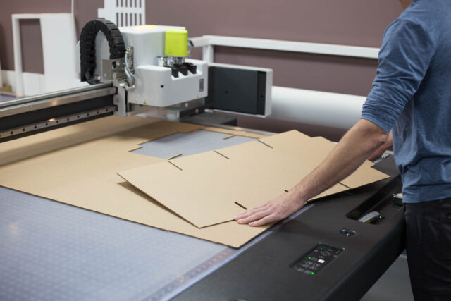 A man working on a cnc machine.