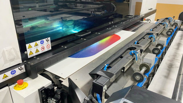 A machine is being used to print on a piece of paper.