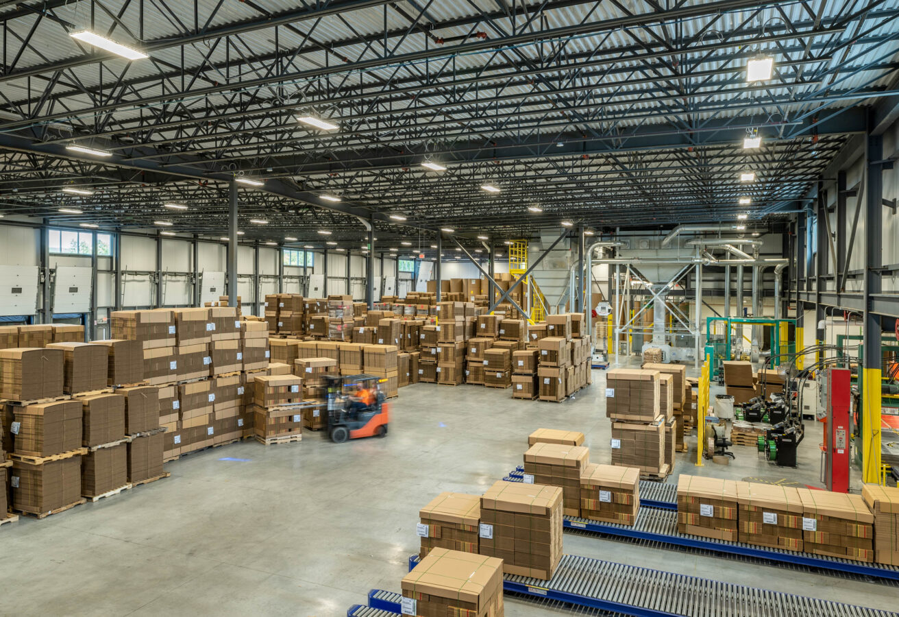 A warehouse full of boxes and pallets.