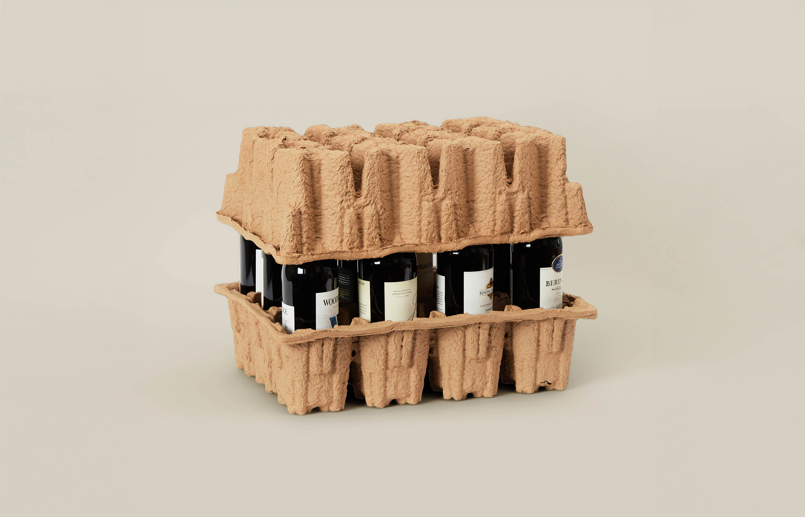 Wine bottles in molded pulp packaging.