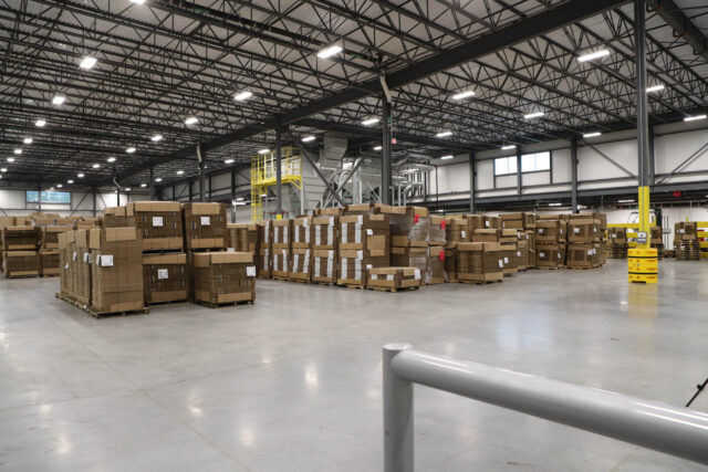 A warehouse full of boxes and pallets.