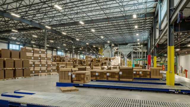 A warehouse filled with boxes and pallets.