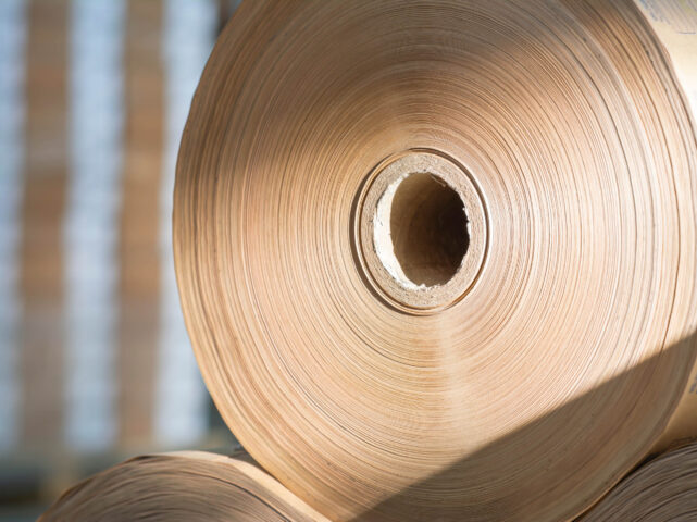 A roll of brown paper in a warehouse.