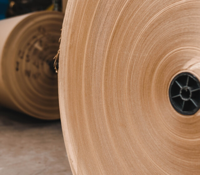 A roll of brown paper in a factory.