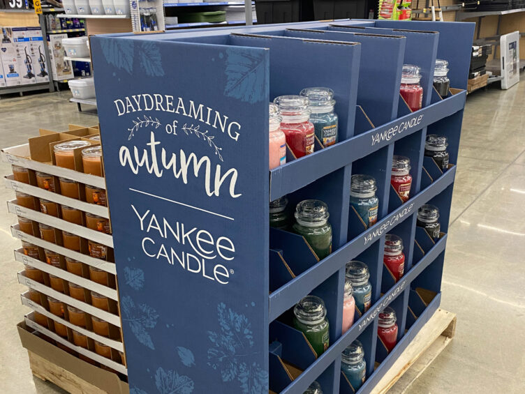 A display of yankee candles in a store.
